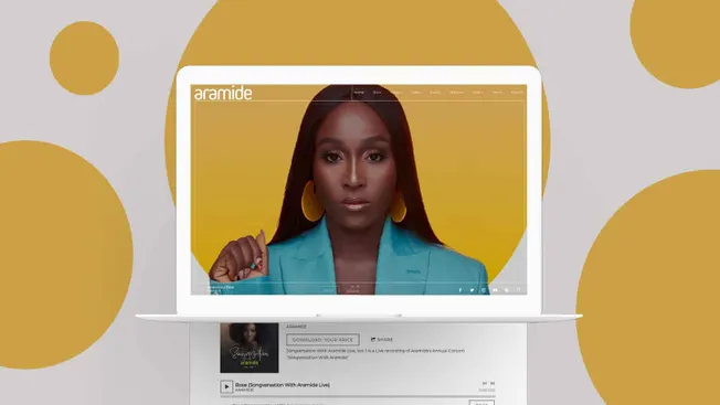 Stylish woman on laptop screen with bold makeup and bright blue blazer, digital music streaming interface, modern music artis