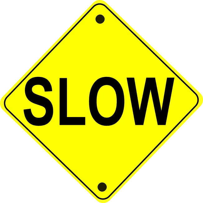 Slow down caution sign with yellow background and black text, used to promote safety and awareness in traffic and constructio