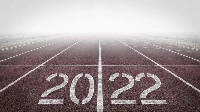 End of the running track with the year 2022 and question marks, representing transition to 2023 and new beginnings, symbolic