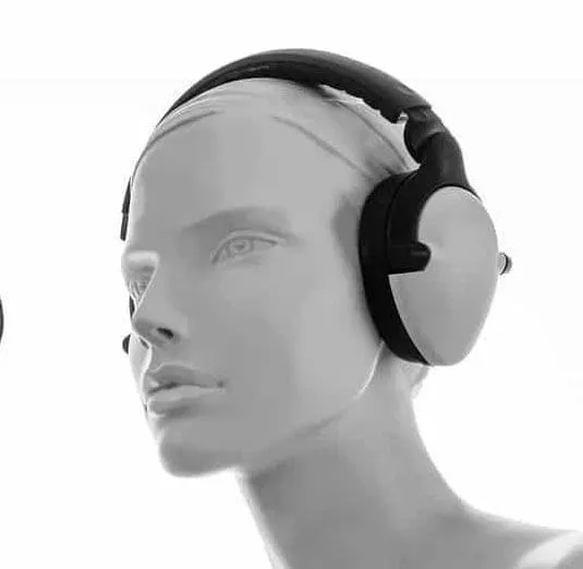 Wireless over-ear headphones on mannequin head for audio testing and sound quality assessment.