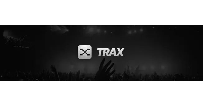 TRAX music software logo at electronic concert, digital DJ equipment, audio production, music streaming, electronic dance mus