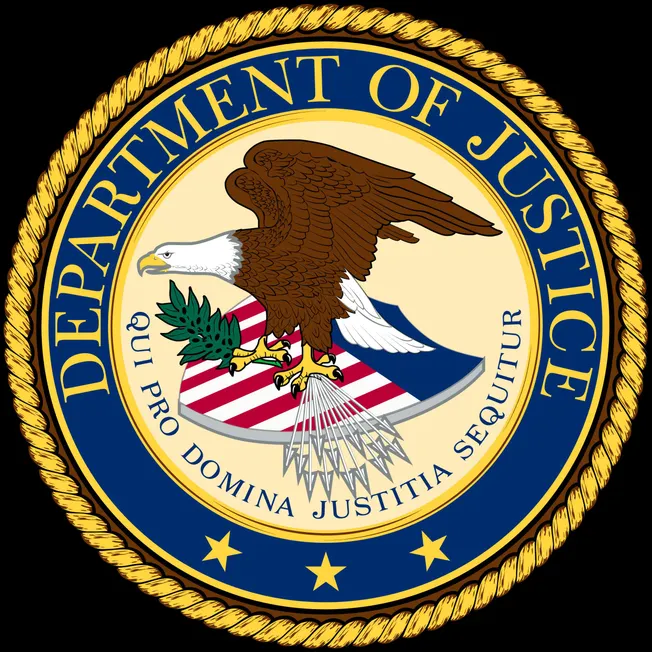 EPLd Un6c2eGvrEnHRtSOiodIZunQhZTi7ZZNLdxD-LmDQ4, badge of the U.S. Department of Justice featuring an eagle clutching a shiel