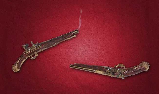 Intricate antique flintlock pistols with ornate designs and wooden engravings displayed on a red textured surface.