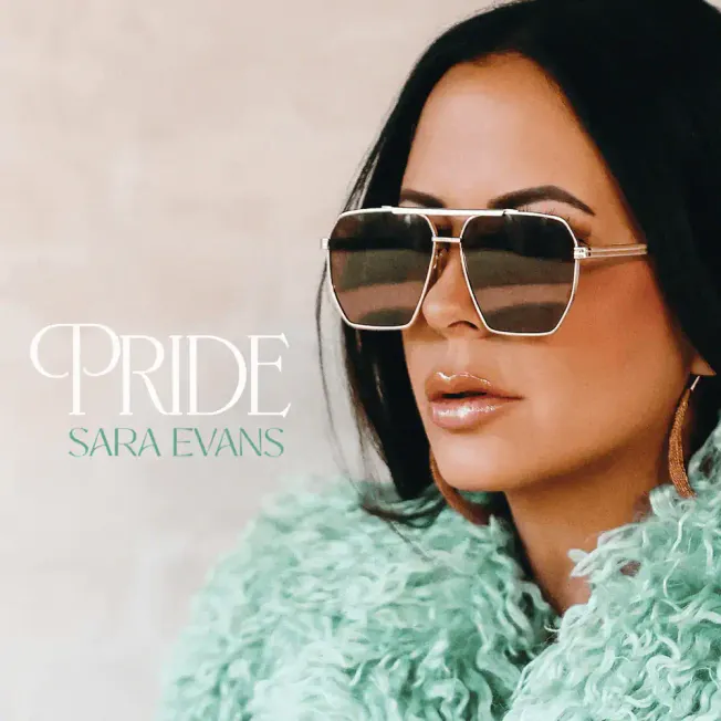 Stylish woman wearing oversized sunglasses and a mint green fuzzy coat, showcasing a modern fashion look; featured in the alb