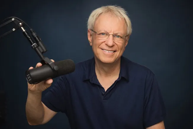 Popular music industry podcast host with microphone in recording studio for music industry insights and digital marketing str