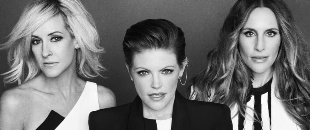 Bold female musicians in black and white portrait, showcasing music industry professionals and artist branding.