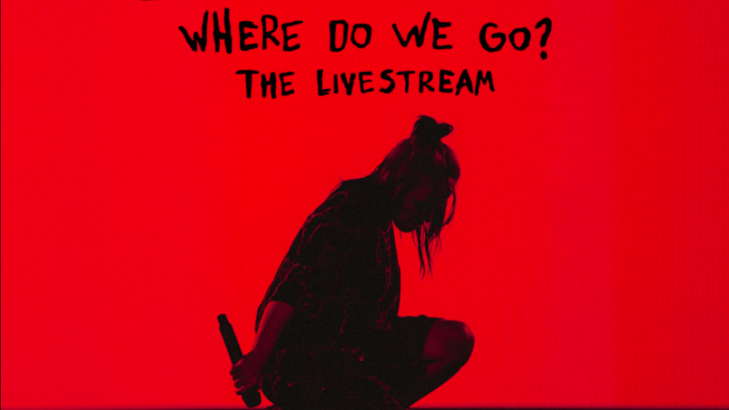 Shot of a female musician with a microphone in hand, kneeling on stage with a red background, promoting livestream concert and music event coverage for live music and entertainment news.