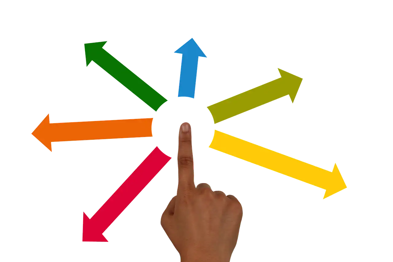 Multi-colored arrows pointing in different directions with a hand pressing a blue arrow, illustrating decision-making or strategic choices in digital marketing or music industry analysis.
