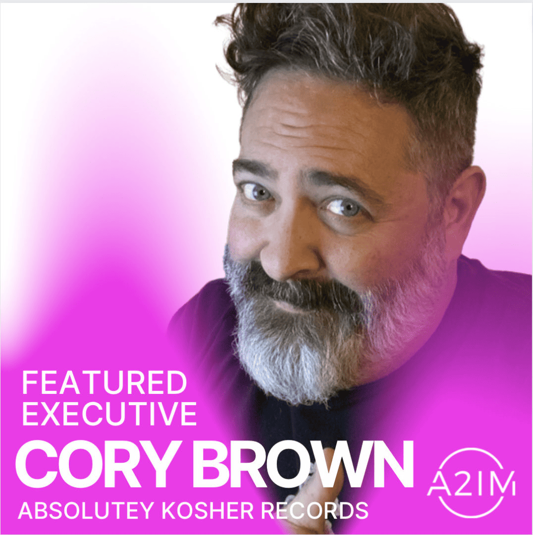 Cory Brown featured executive at ABSOLUTY KOSHER RECORDS, promotional photo for Hypebot, showcasing a professional headshot of a middle-aged man with gray beard and styled hair, emphasizing leadership in the music industry.