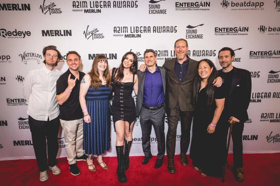 Group of people attending the A2IM Libera Awards red carpet event, showcasing music industry professionals, artists, and organizers at a high-profile entertainment industry celebration.