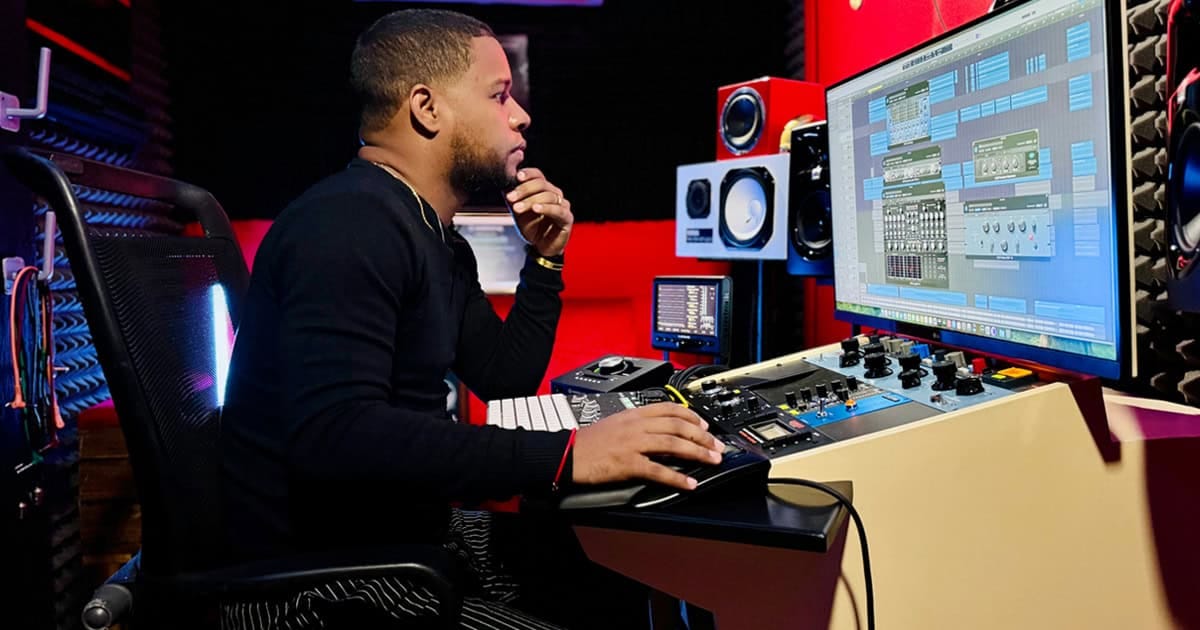 Creative music production in a professional studio using a digital audio workstation, mixing consoles, and studio monitors for high-quality sound engineering and music creation.