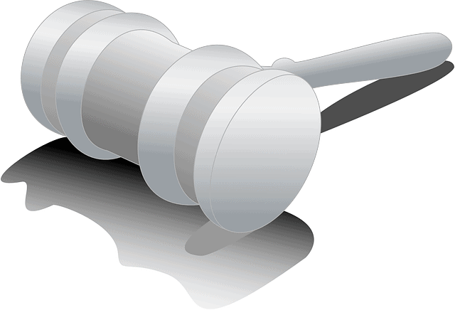 Gavel and judicial hammer on table representing legal decision making and law enforcement.