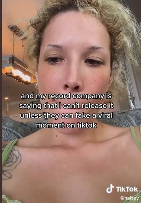 Record company dispute about releasing viral TikTok videos, focusing on music industry and social media trends.