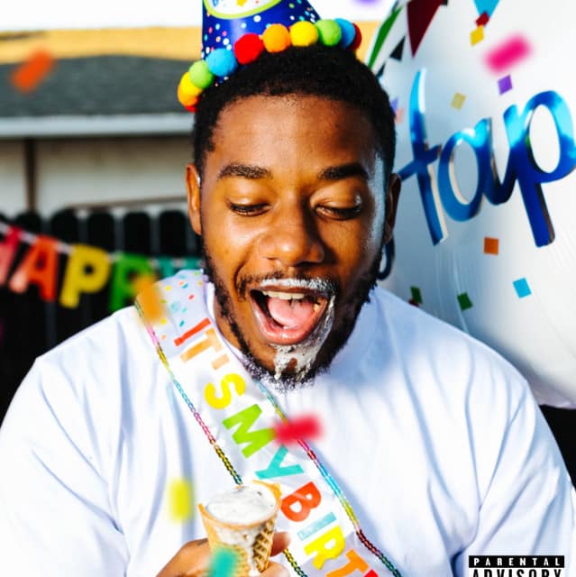 Colorful birthday celebration with man wearing party hat, confetti, and birthday decorations, enjoying ice cream cone, emphasizing festive atmosphere, happiness, and special occasion.