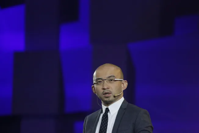 Bao Fan of China Renaissance speaking on stage