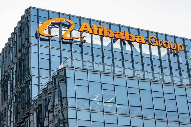 Alibaba Group logo on a glass office tower