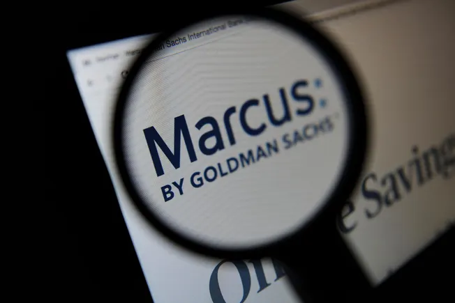 Marcus by Goldman Sachs logo under a magnifying glass