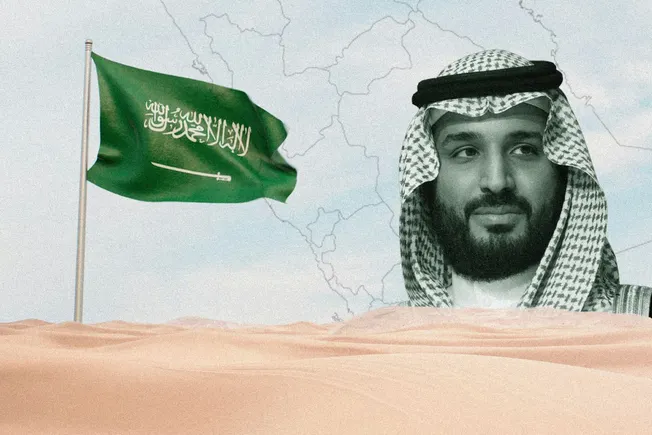 Saudi Crown Prince Mohammed bin Salman beside a Saudi flag over a desert