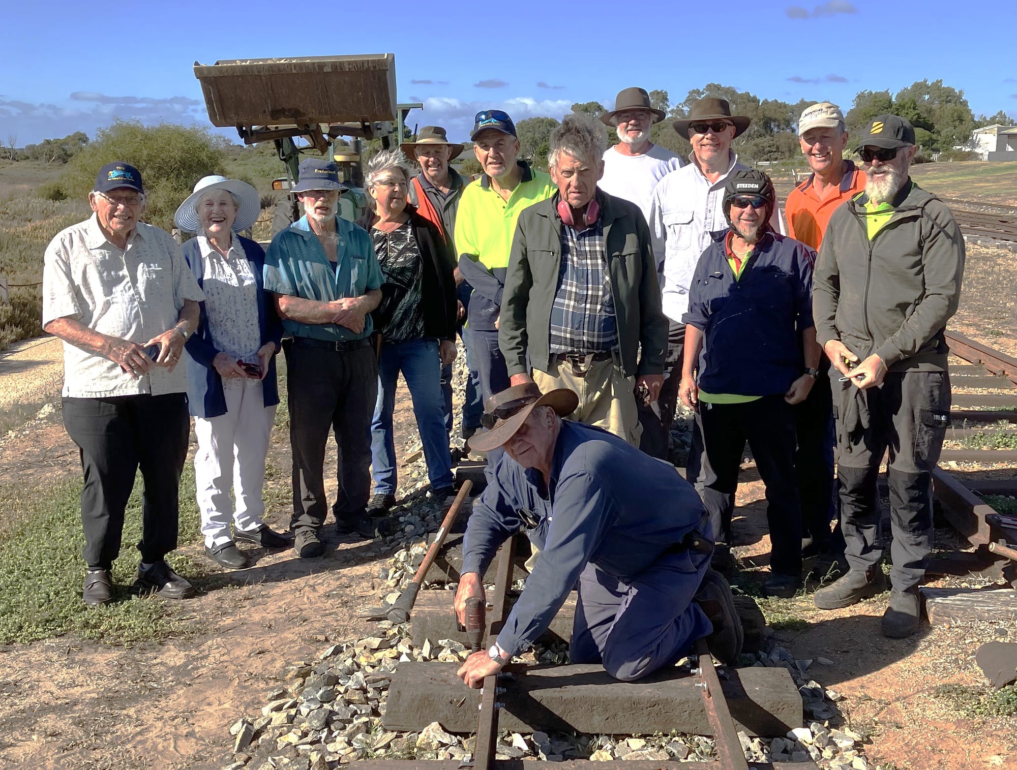 Golden spike nailed to track