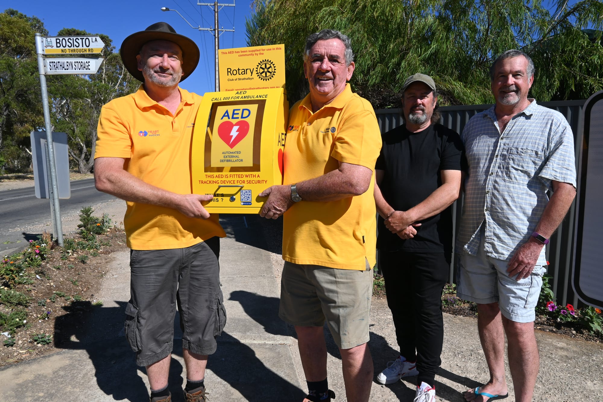 Rotarians install another lifesaving AED device