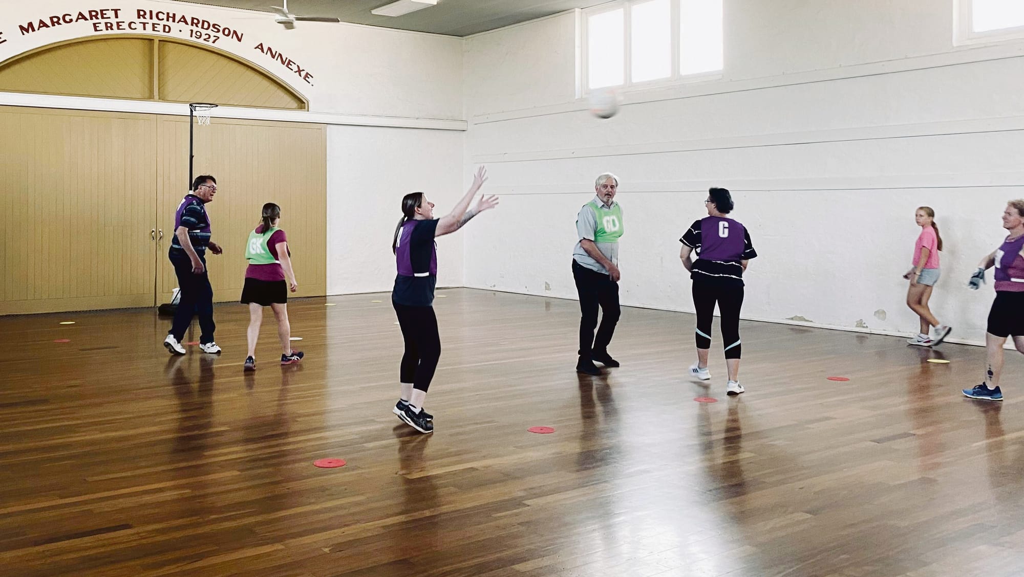 Strathalbyn netballers taking a walk inside show hall
