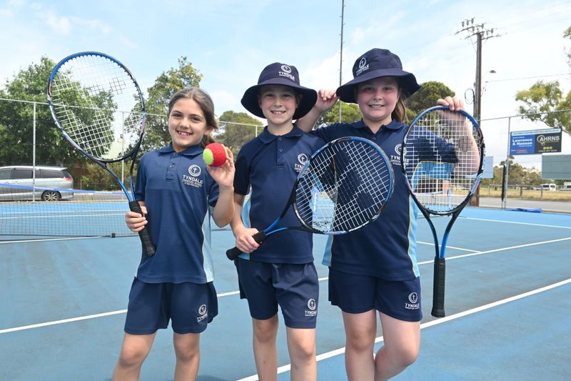 Students take a swing at tennis post image