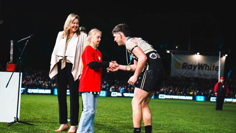 Local teenager reunited with Port Adelaide hero post image