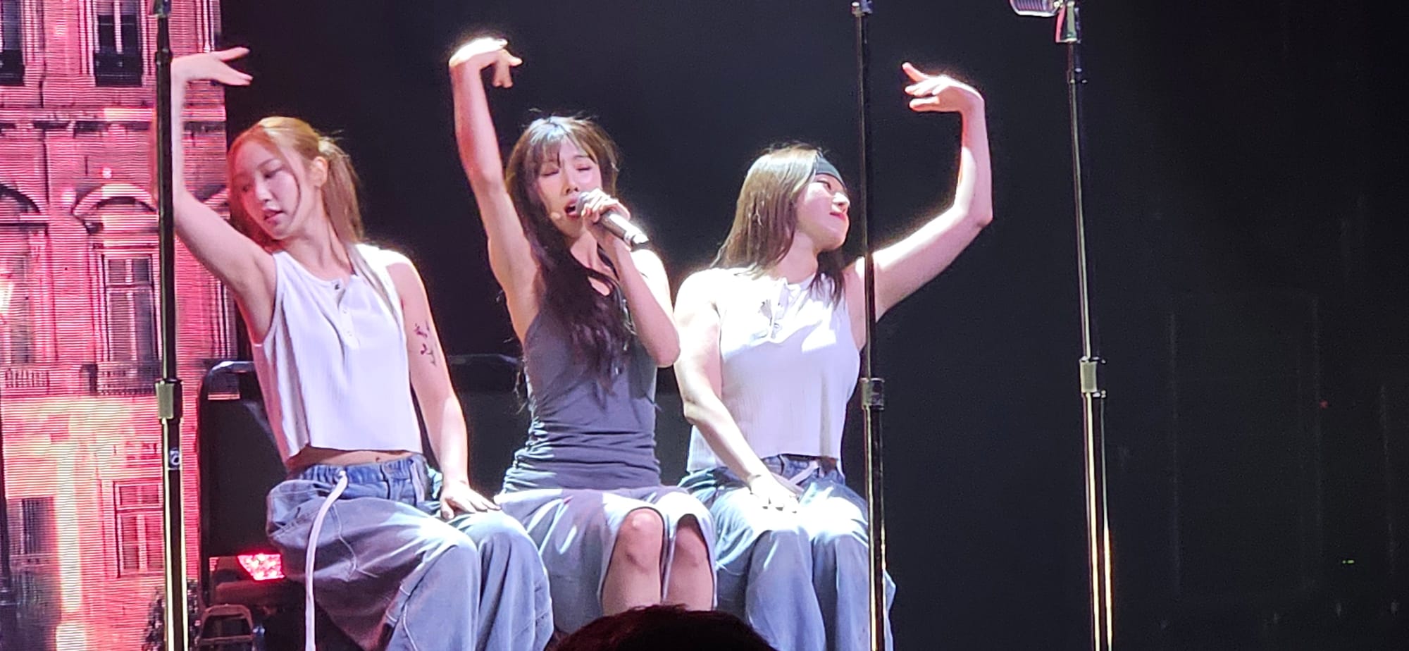 Yoohyeon, with choreographer Keeyeoun and performance director Sooyeon, performing "For".