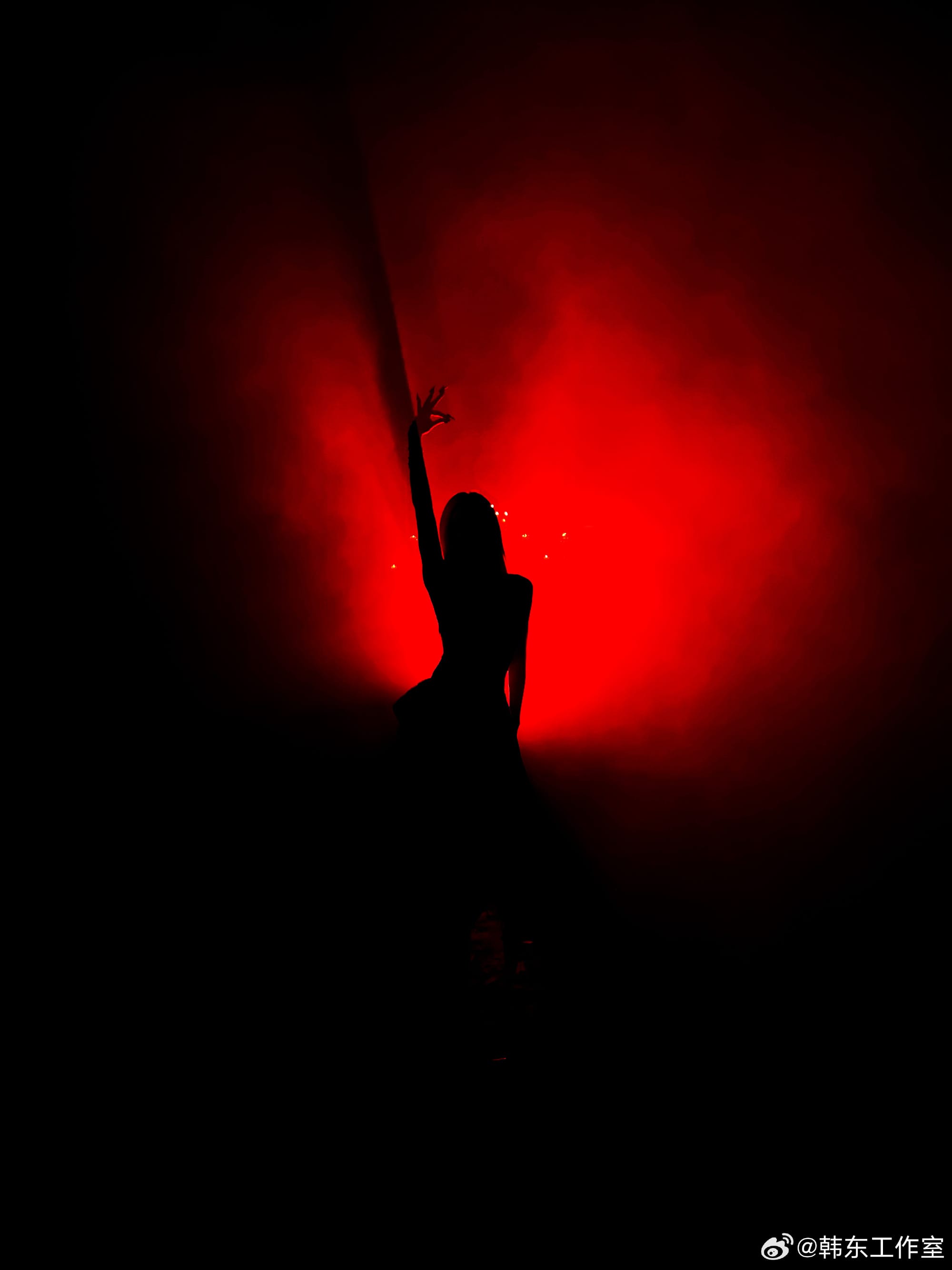 Handong's shadow against a red background.