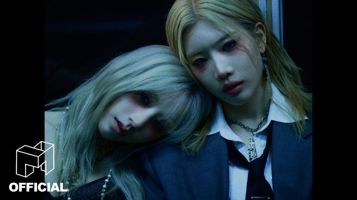 ARTMS members Heejin and Kim Lip look bleakly at the camera in their "Birth" MV. 