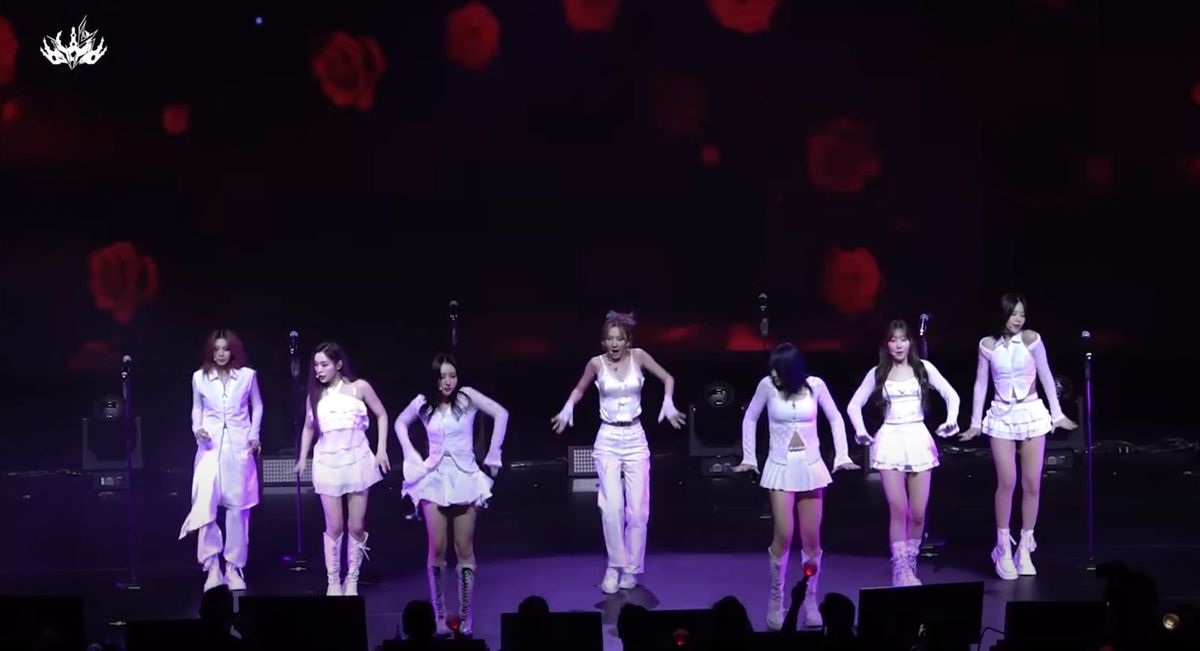 Dreamcatcher in white performing on stage in New York City.