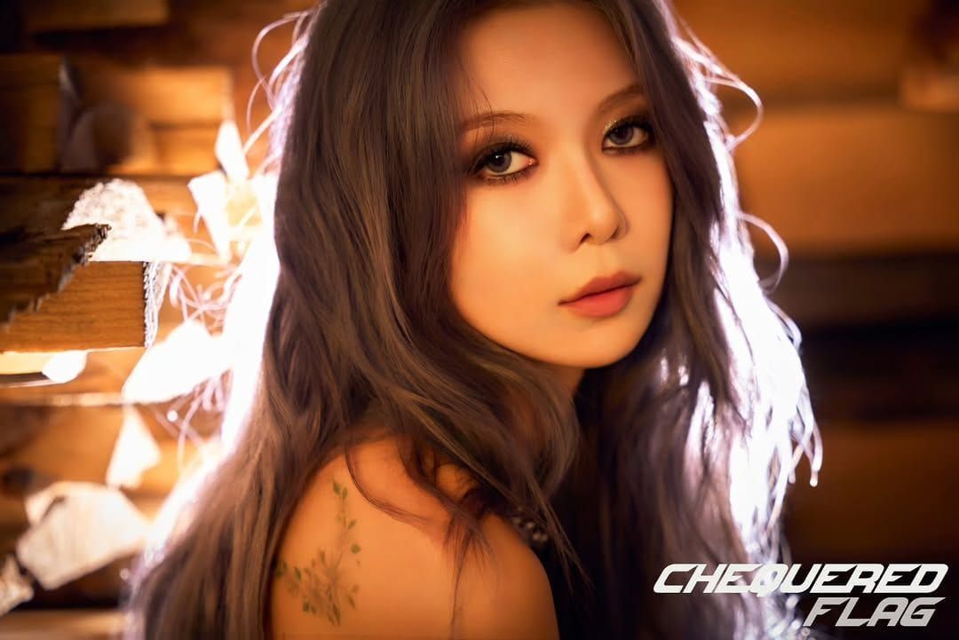 Dreamcatcher Dami looks at the camera for concept photos for her album.