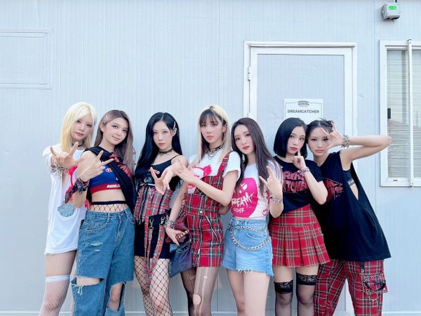 Dreamcatcher group picture at Primavera Sound 2022, dressed in Dreamcatcher rock-themed fashion.