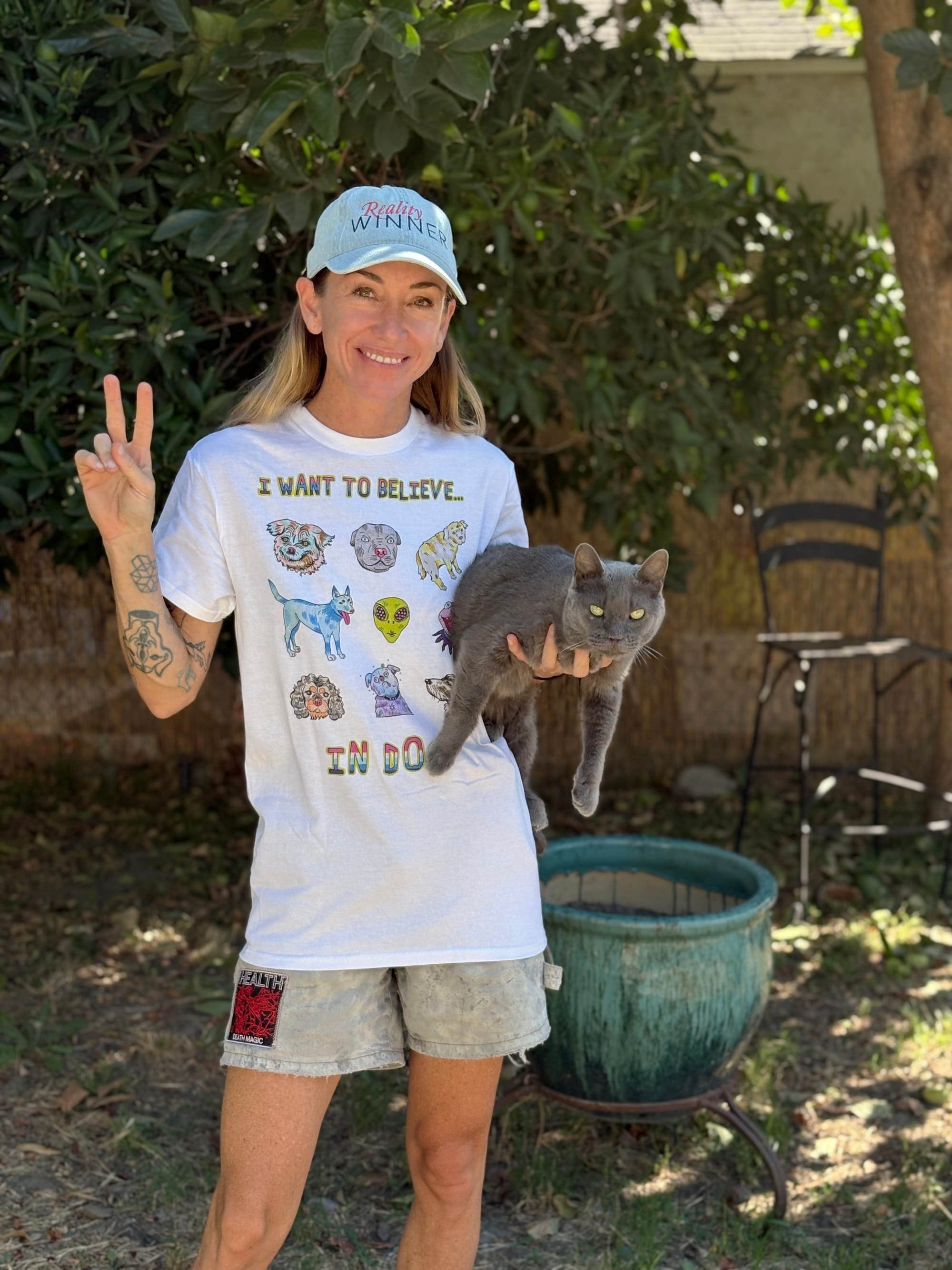 Jess in the tee which features illustrations of dogs
