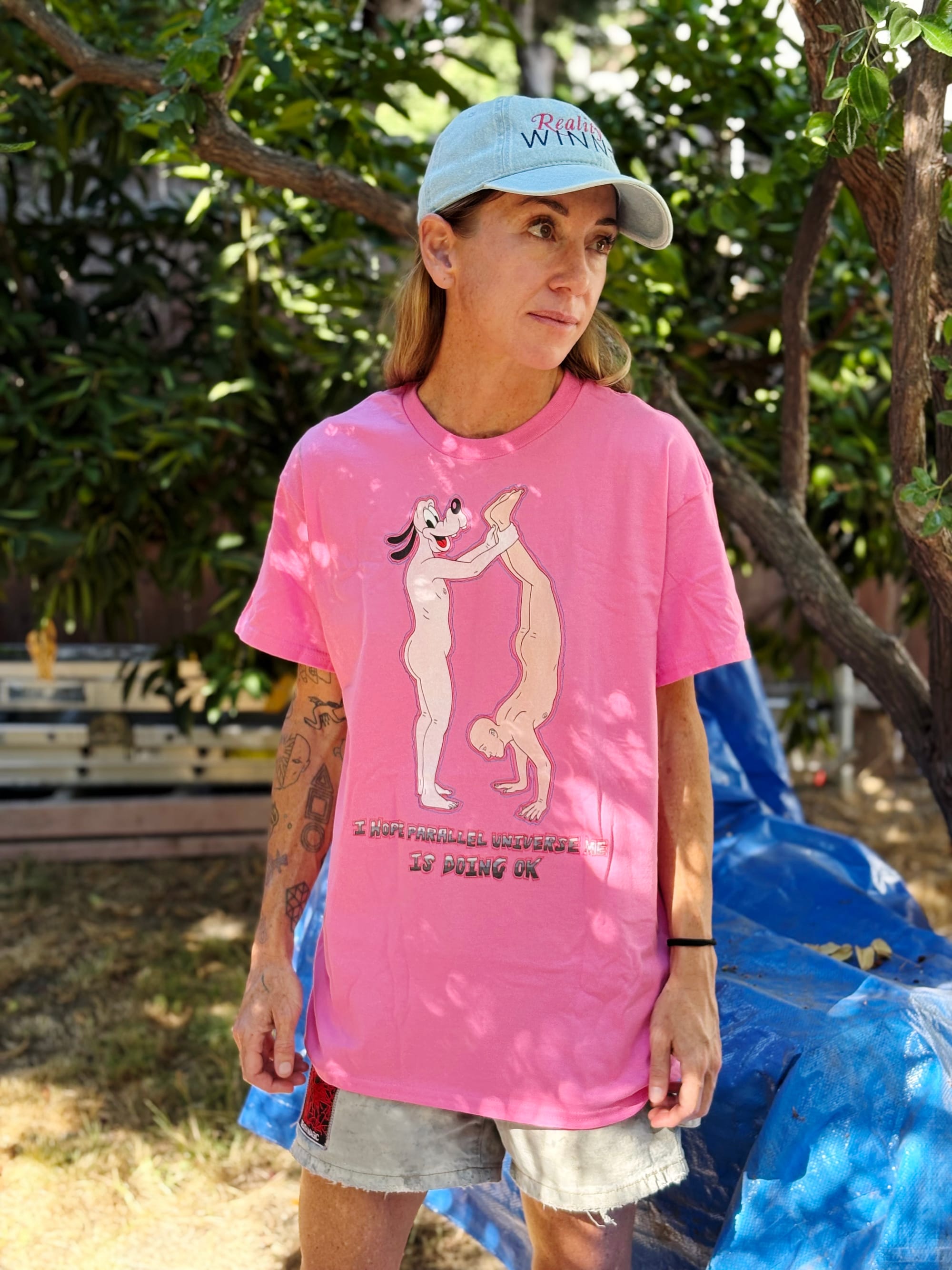 A horrible man dog holding a naked man