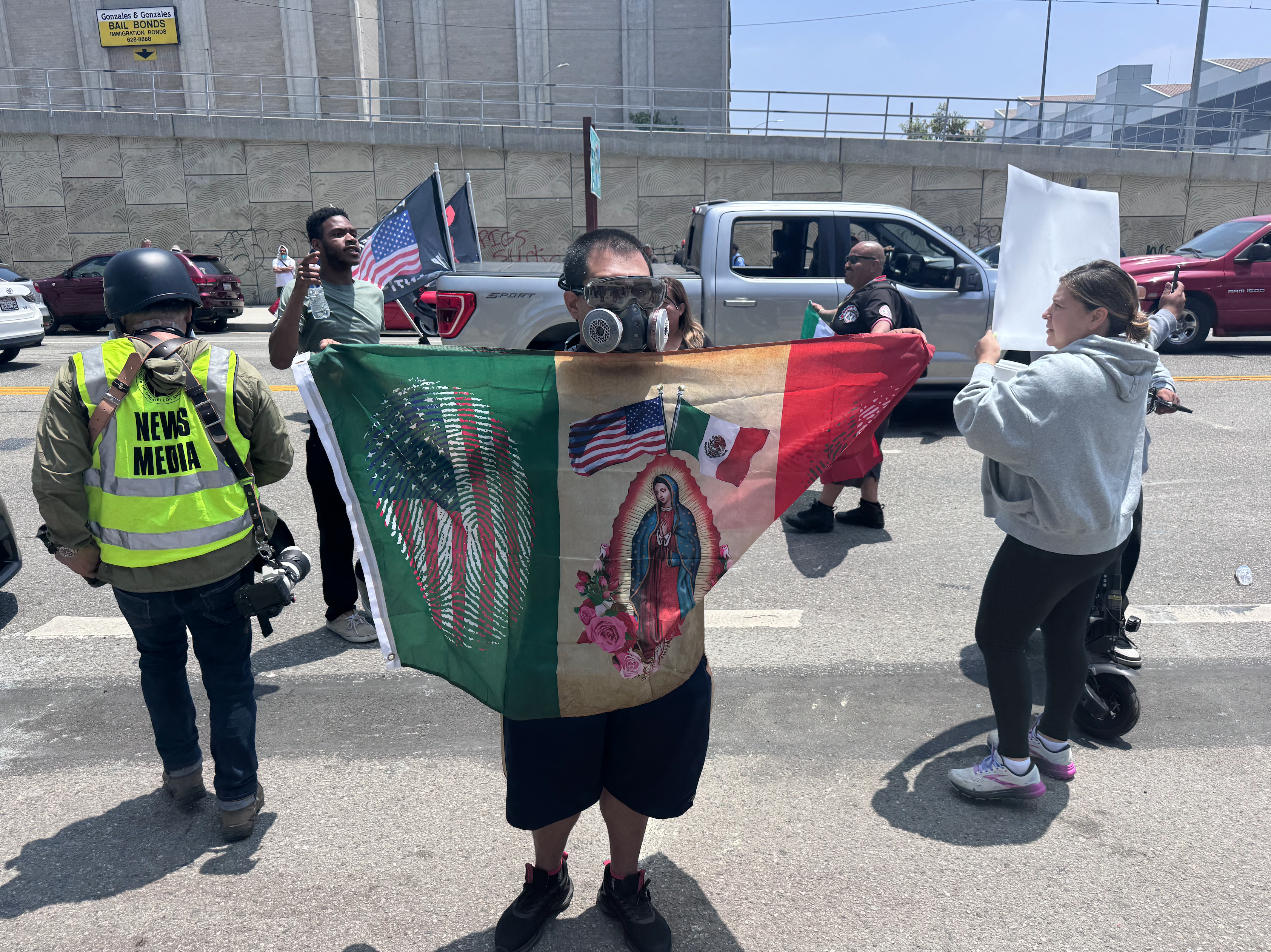 Man holding flag and gas mask
