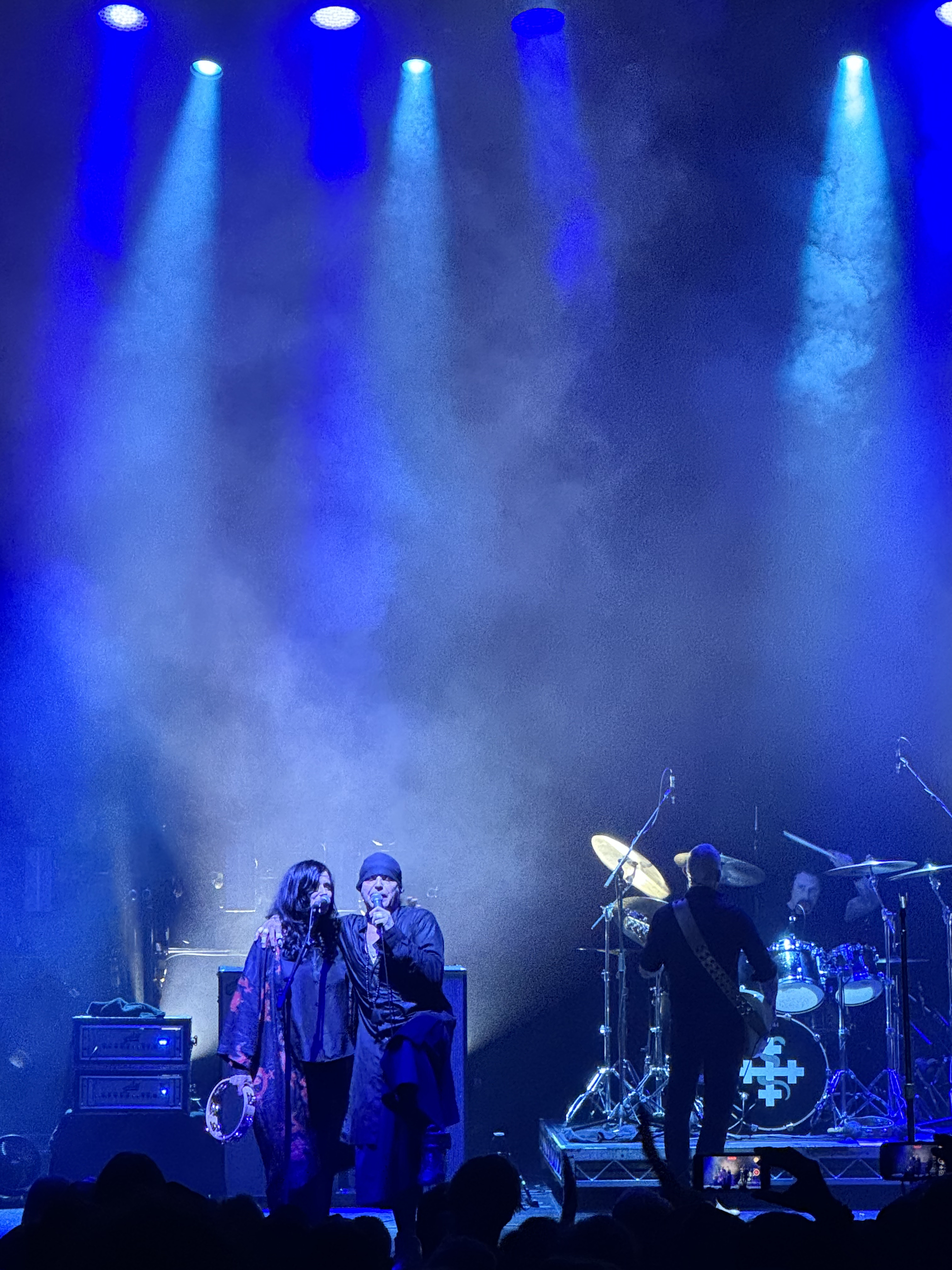 Ian Astbury and Aimee Nash side by side on stage