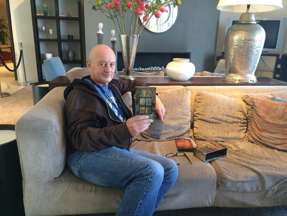 Simon Maxwell on a couch