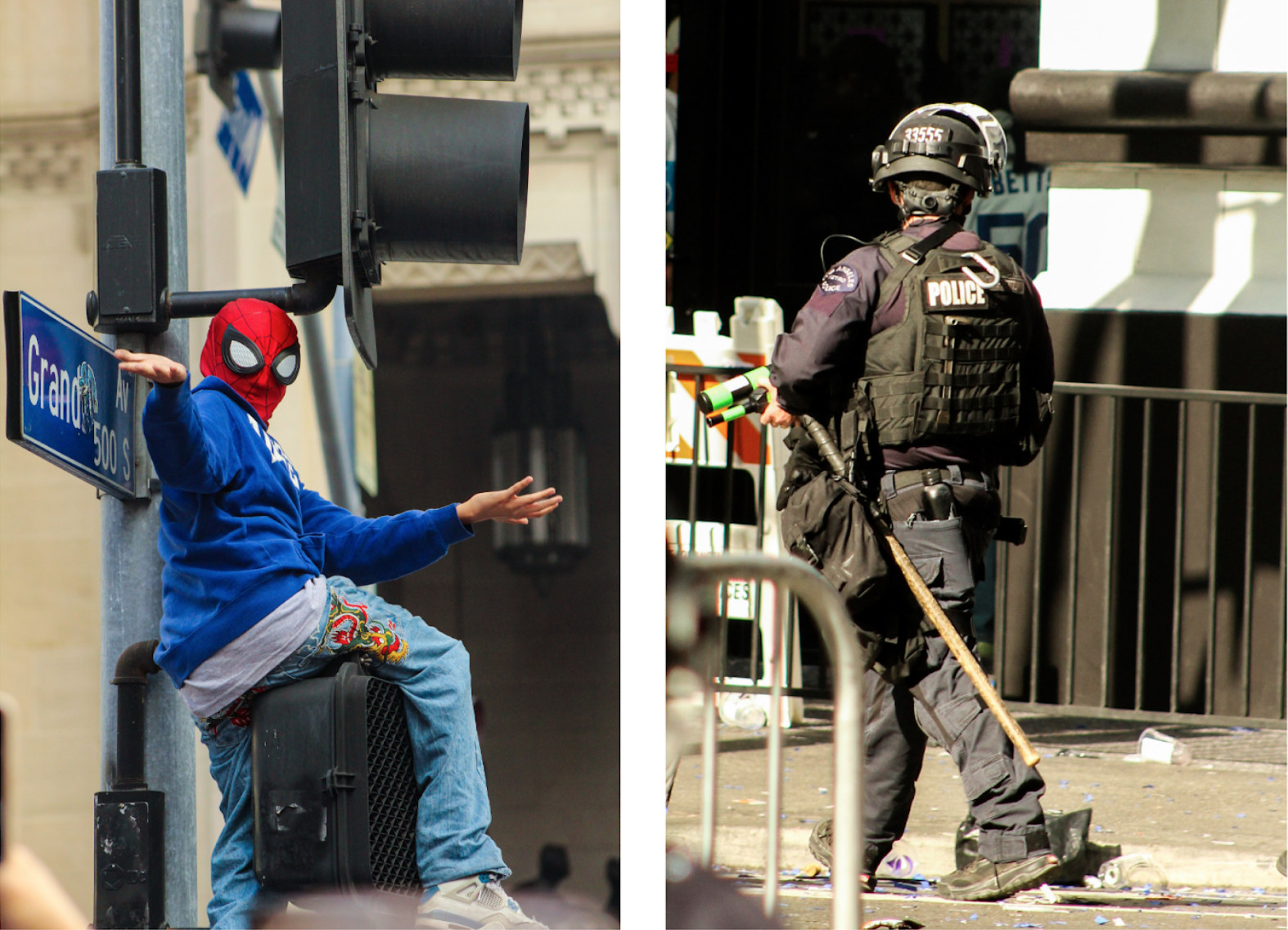 Spiderman up a post, cop standing there