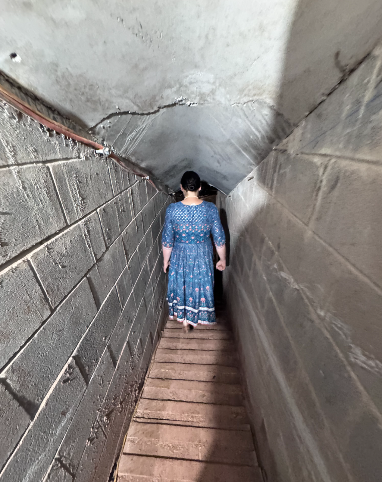 Tunnel girl descending into tunnel