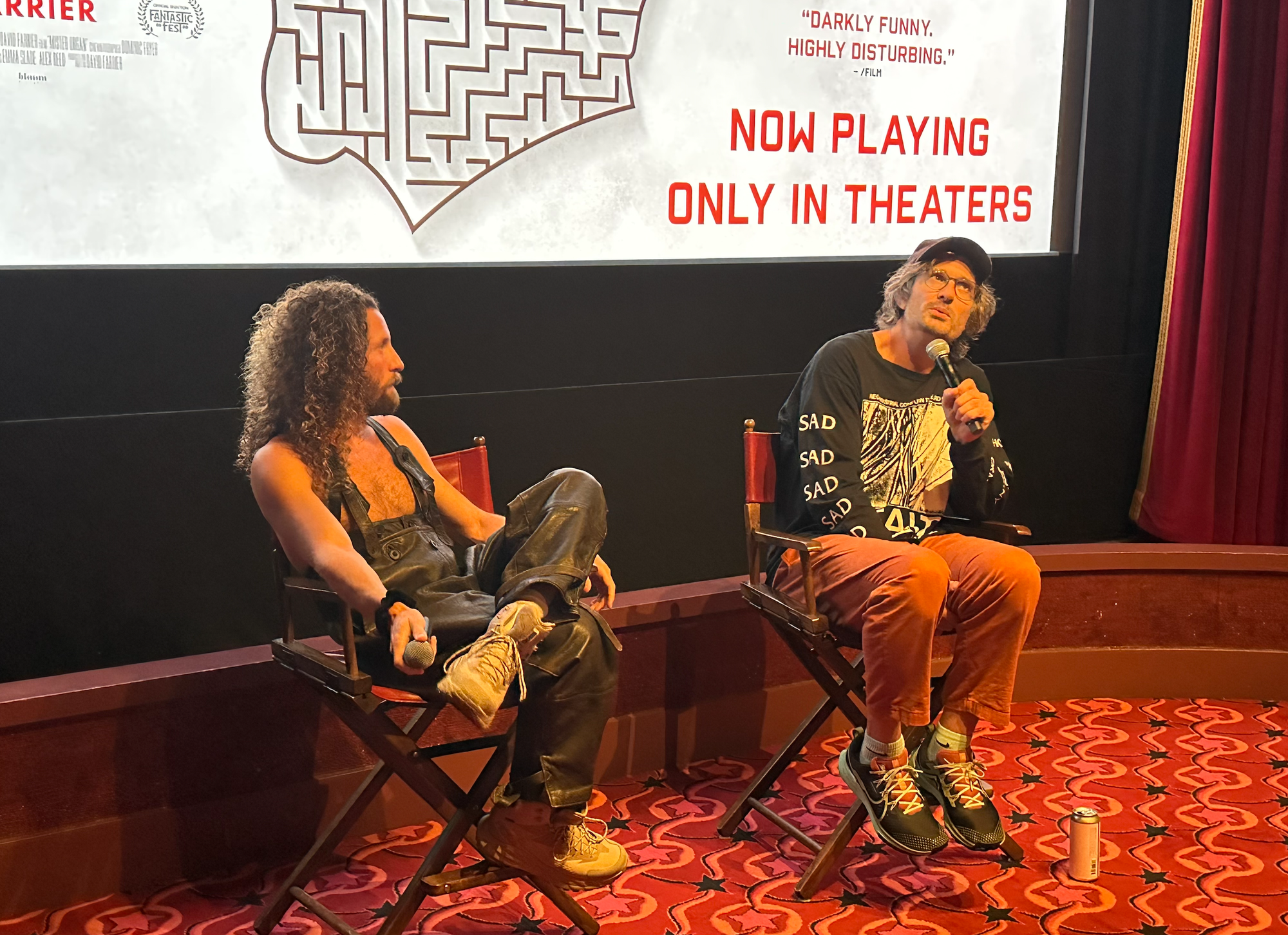 Sean Glass in overalls and not much else