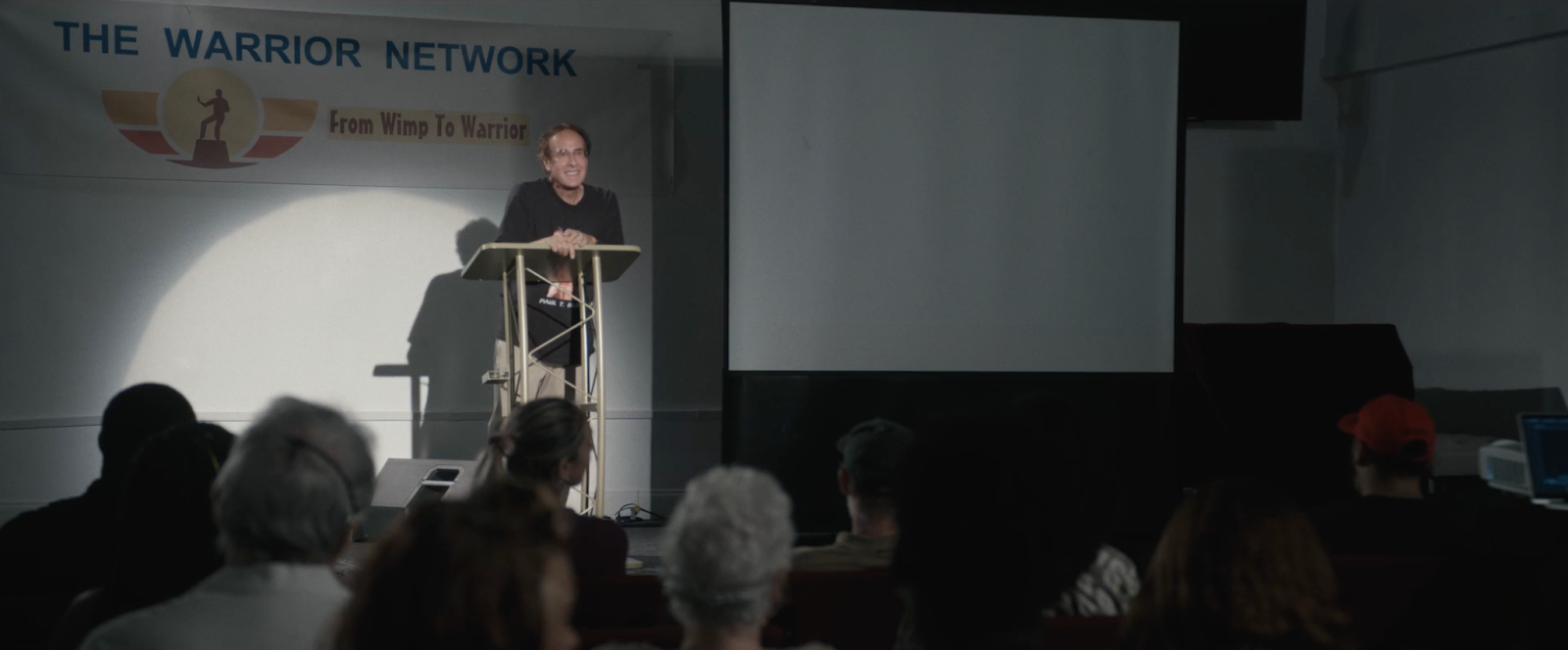 Paul T Goldman on stage being asked about his Russian bride