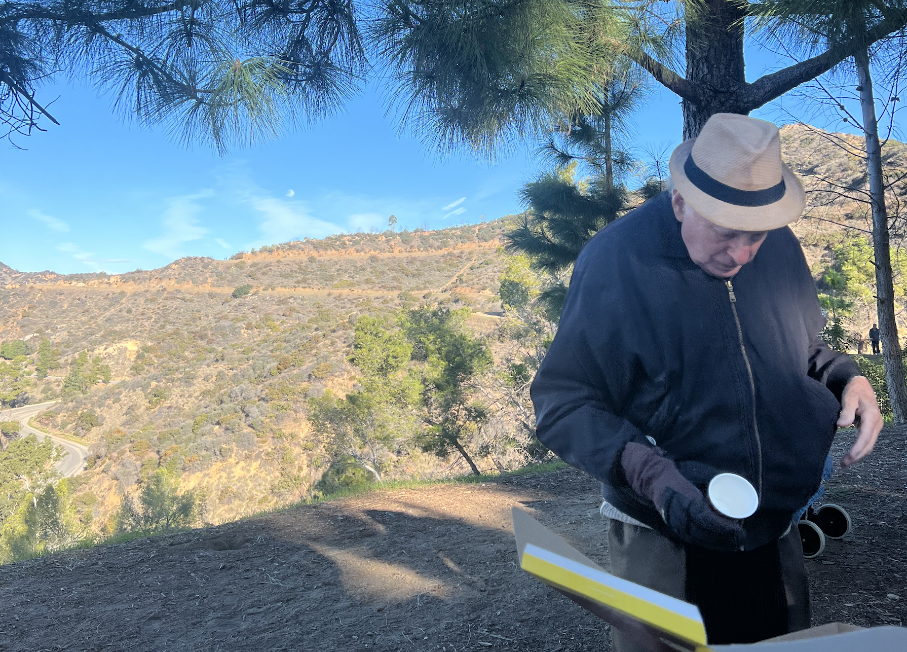 An old man in a hat attending Pete's birthday