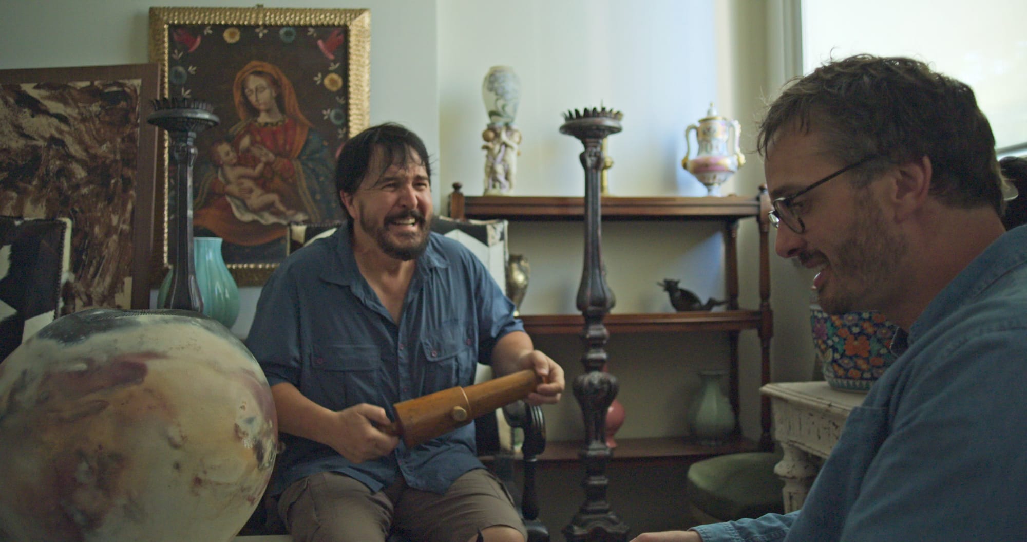 Mister Organ laughing while gripping antique