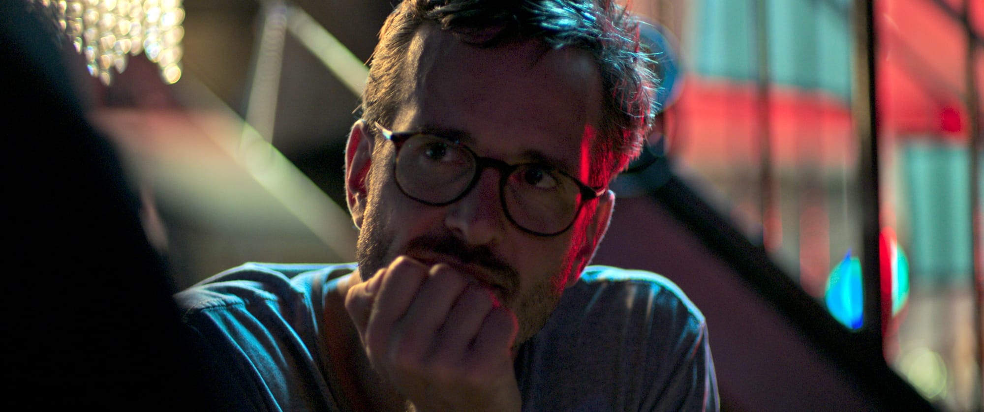 Still from Mister Organ: Director David Farrier listening