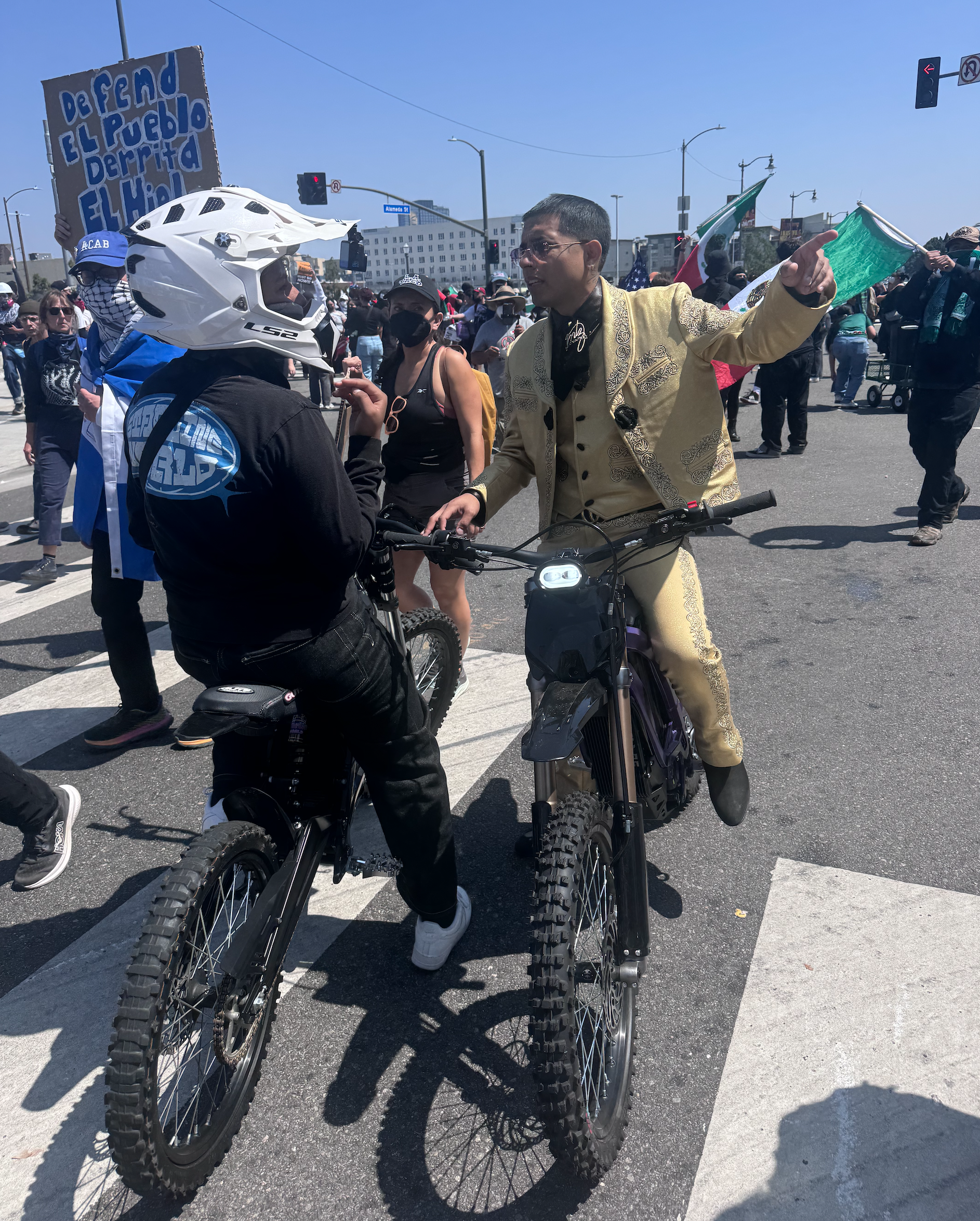 Men on bikes in nice suits