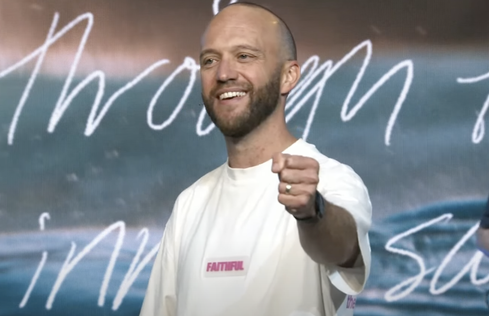 Ben Kendrew on stage smiling