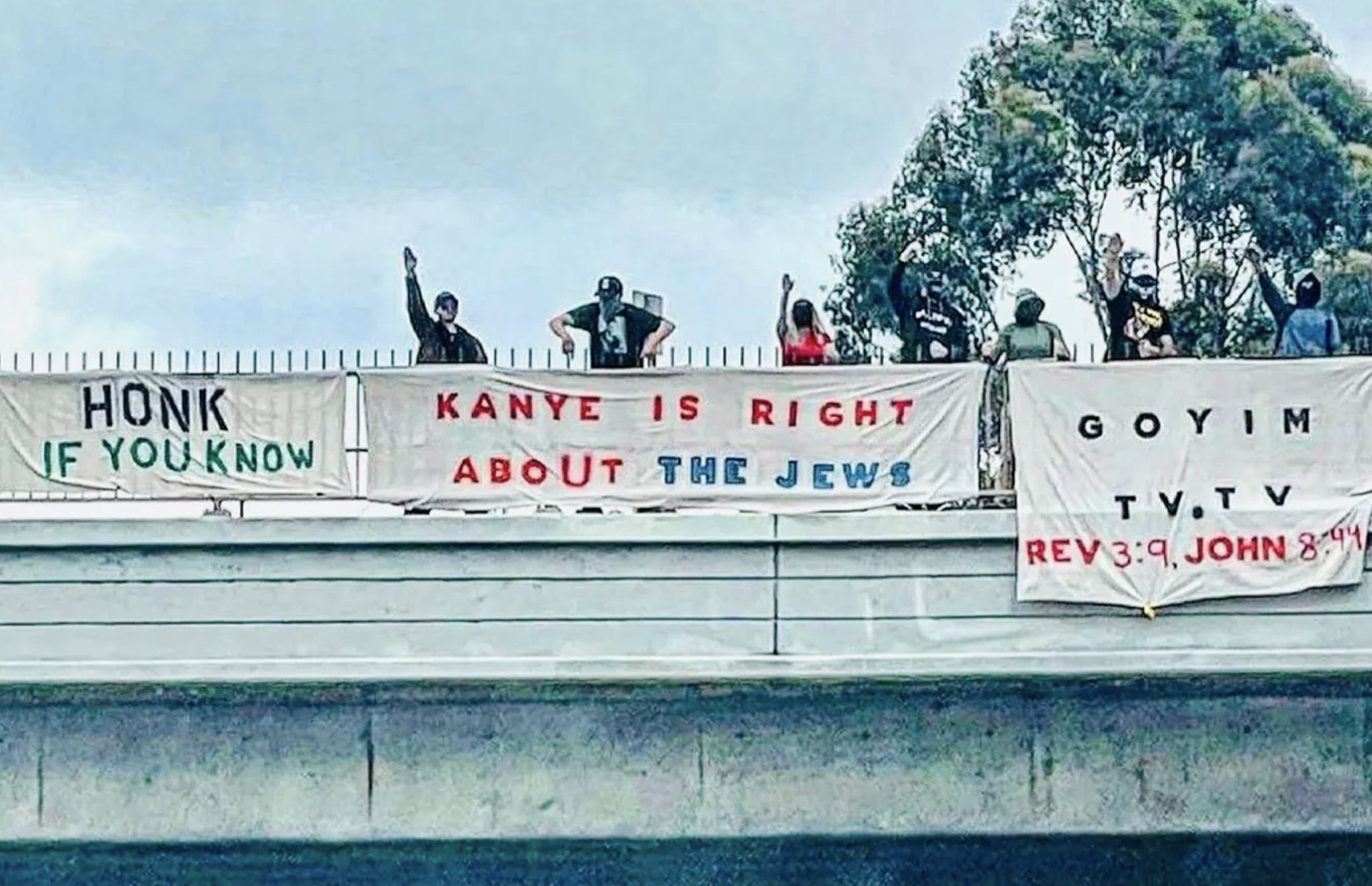 "Kanye is right about the jews" on a banner while peope give the heil hitler salute
