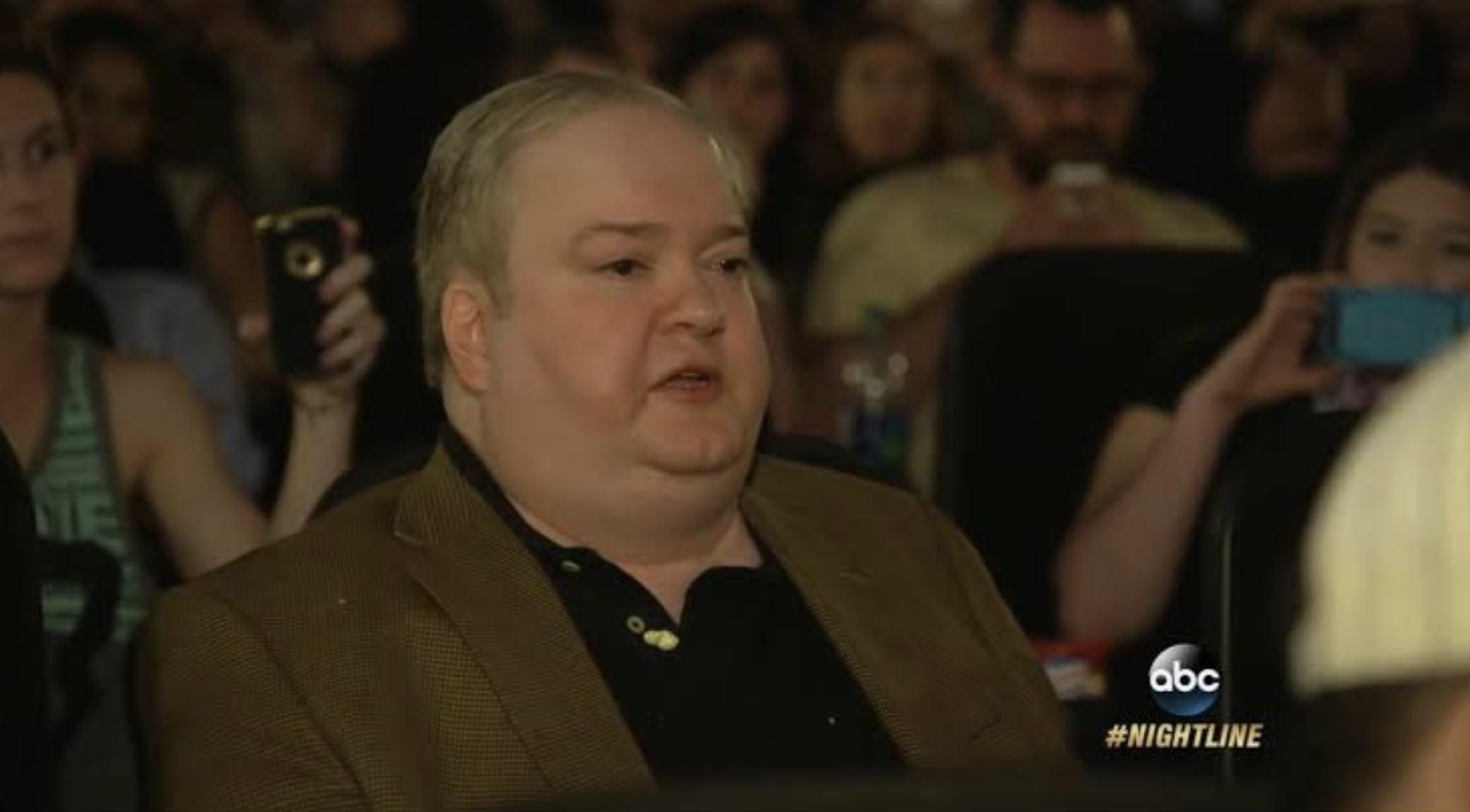 D'Amato sitting in a screening of Tickled