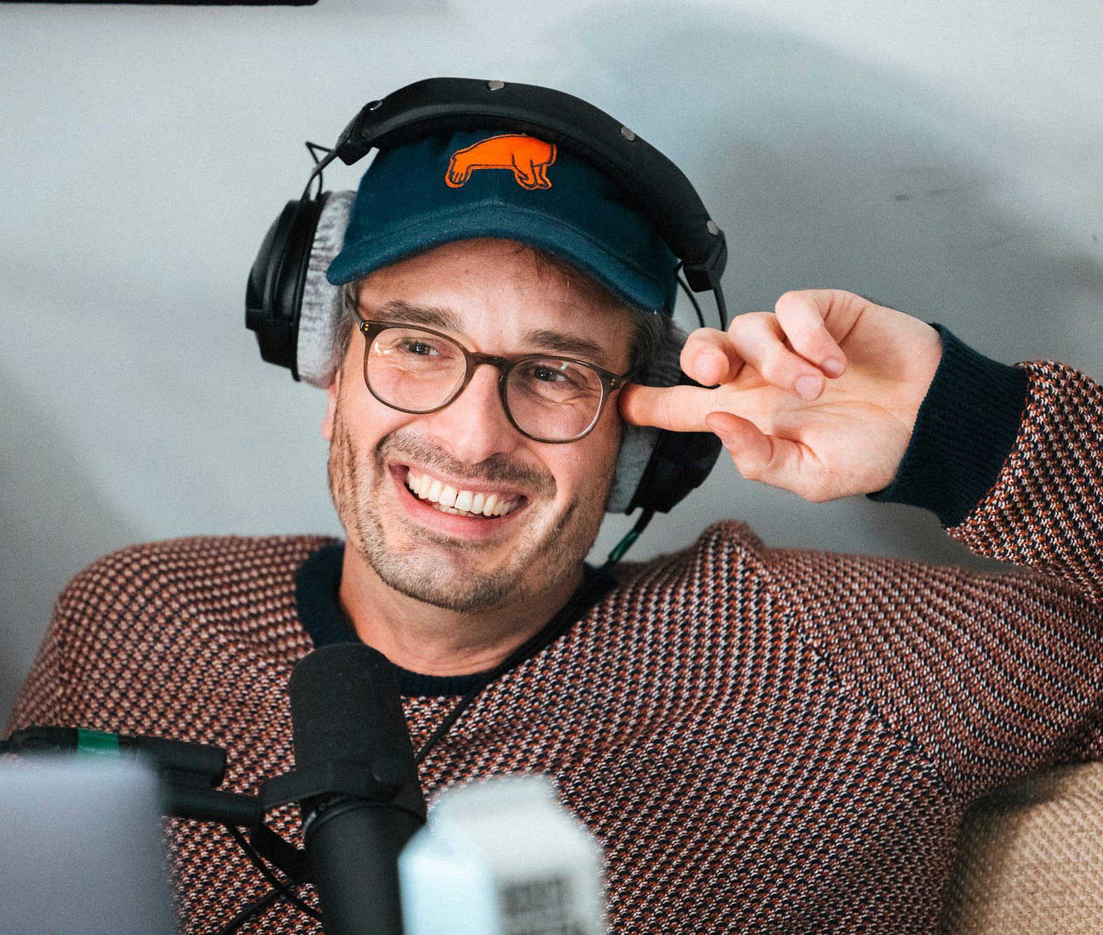 Me grinning like an idiot while recording Flightless Bird in the Armchair Expert attic